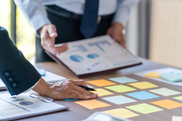 istock Business People brainstorming Meeting Design Ideas use post it notes to share idea professional investor start up project business brainstorming planning in office 1803627593