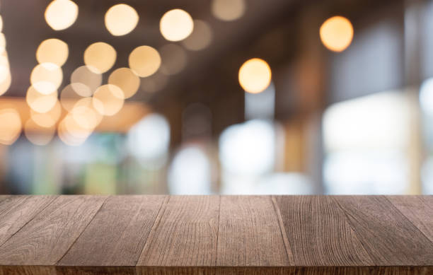 istock Mock up for space. Empty dark wooden table in front of abstract blurred bokeh background of restaurant . can be used for display or montage your product 1803632716