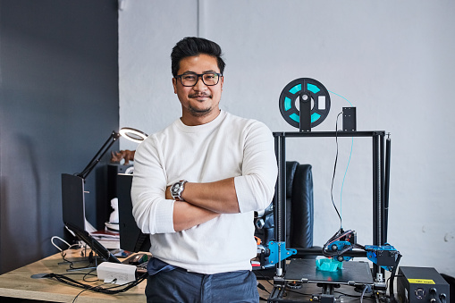 Portrait, man and engineer with arms crossed, 3d printing and creative innovation. Glasses, confidence and professional technician, employee and worker or designer in manufacturing business in Japan
