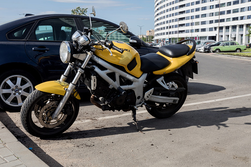 Minsk, Belarus, November 20, 2023 -  Suzuki sport bike motorcycle parking on city street.