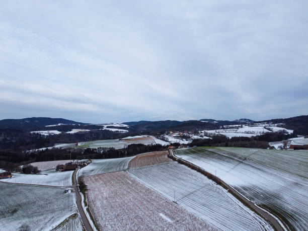 istock snow-covered agricultural fields in bavaria on a cloudy 1803637316