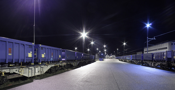 nocturnal urban scene with trains at a marshalling yard