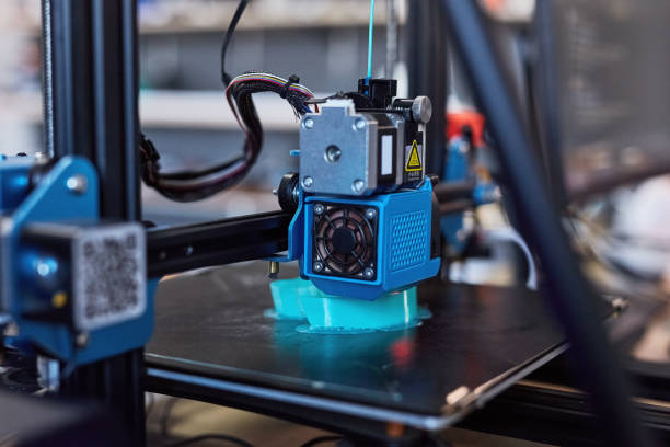 istock 3D, printing and manufacturing machine and technology with blue plastic mold or automation testing. Futuristic, industry and printer with prototype of design, object or three dimensional print 1803644709