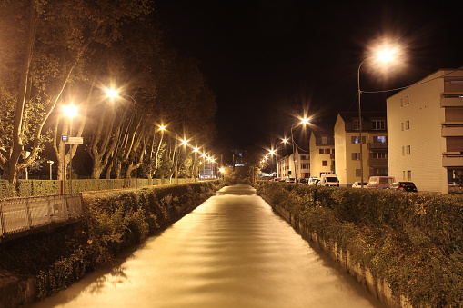 urban landscape with water canal flowing through a residential district