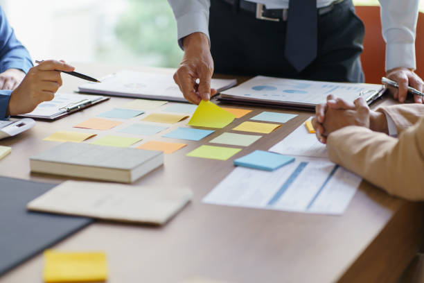 istock Business People brainstorming Meeting Design Ideas use post it notes to share idea professional investor start up project business brainstorming planning in office 1803647484
