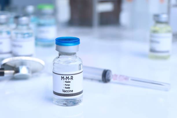 Measles, Mumps, Rubella vaccine in a vial, immunization and treatment of infection Measles, Mumps, Rubella vaccine in a vial, immunization and treatment of infection, scientific experiment measles stock pictures, royalty-free photos & images