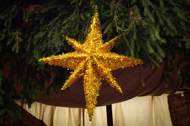 Golden star on the Christmas tree, Christmas star,