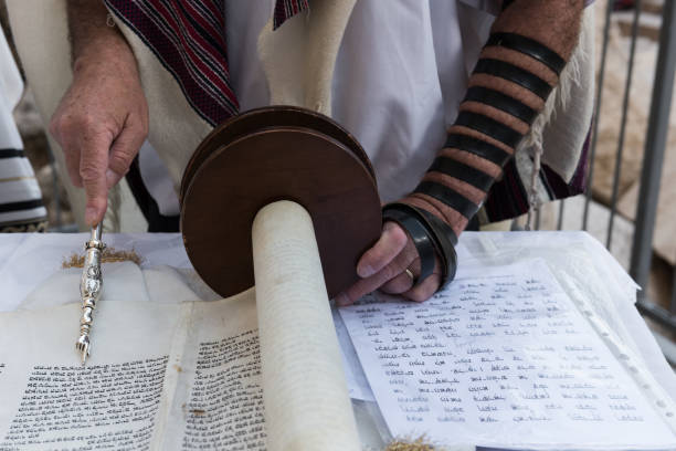 istock A reader of the Torah uses a yad or pointer as a guide 1803695519