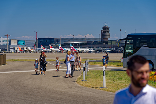 Sightseeing tour with scenic view of Zürich Airport with terminal in the background on a sunny late spring day. Photo taken June 14th, 2023, Kloten, Canton Zurich, Switzerland.