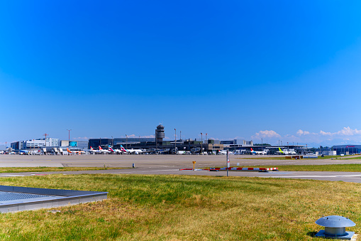 Sightseeing tour with scenic view of Zürich Airport with terminal in the background on a sunny late spring day. Photo taken June 14th, 2023, Kloten, Canton Zurich, Switzerland.