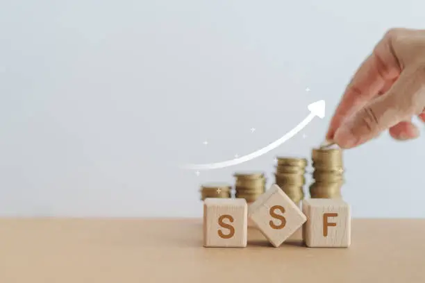 Passive income, Pension and retirement concept. Investment in business development for growth and success, dividend payment to investors. SSF abbreviation of Super Saving Fund on wooden cube block