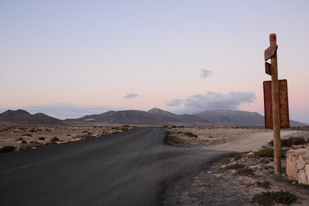 istock Countryside Desert Dirt Road 1803710899