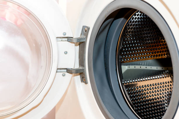 istock Old dirty washing machine close up, selective focus, door open 1803731063