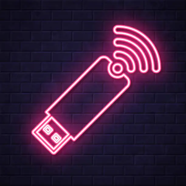 Vector illustration of USB wireless adapter. Glowing neon icon on brick wall background