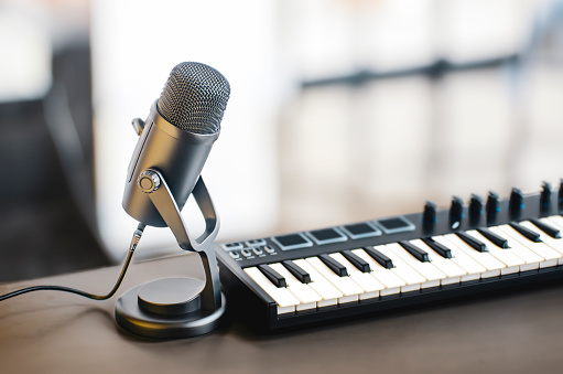 microphone and midi - keyboard on the table