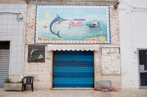 Closed Fish Shop in a Mediterranean Sea Village in South Italy During a Winter Day. Porto Cesareo, Lecce Province, Salento