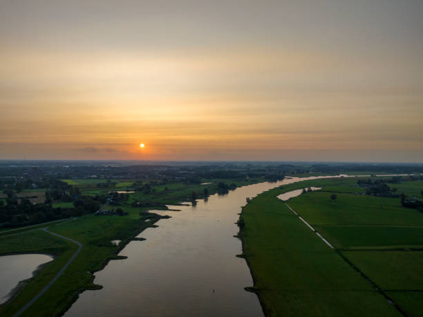 istock IJssel sunrise panoramic landscape view 1803745267