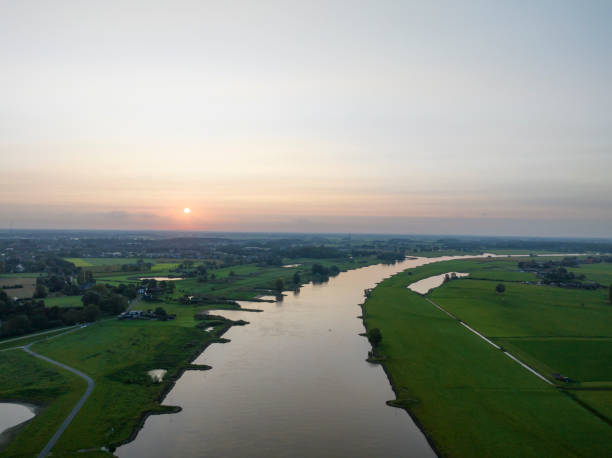 istock IJssel sunrise panoramic landscape view 1803746257