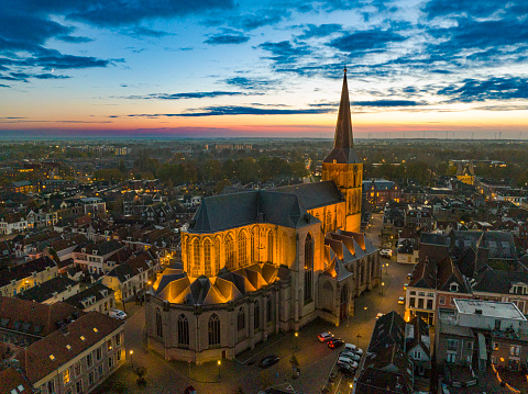 Bovenkerk in the old town of Kampen during an atumn sunset seen from above with the Oudestraat in the background. The Bovenkerk or the Church of St. Nicholas is a large, Gothic church and the most striking element on the skyline of Kampen at the river IJssel in the Overijssel province.