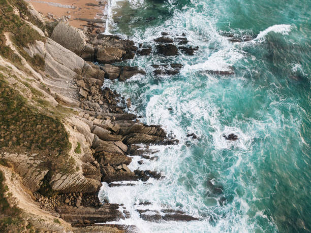 istock Rocks by the sea from above 1803753000