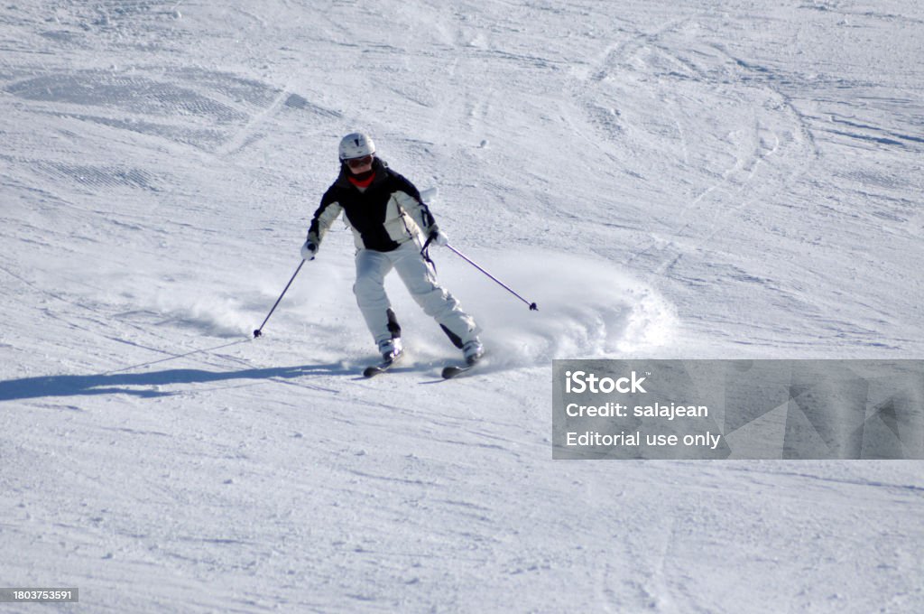 Unidentified skier skiing down the slope in a beautiful sunny day, in Kitzsteinhorn, Austrian Alps Kaprun, Austria - March 5, 2012: Unidentified skier skiing down the slope in a beautiful sunny day, in Kitzsteinhorn, Austrian Alps Activity Stock Photo Unidentified skier skiing down the slope in a beautiful sunny day, in Kitzsteinhorn, Austrian Alps Kaprun, Austria - March 5, 2012: Unidentified skier skiing down the slope in a beautiful sunny day, in Kitzsteinhorn, Austrian Alps Activity Stock Photo