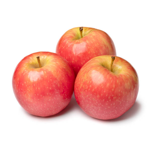 Group of whole fresh Pink Lady apples isolated  on white background