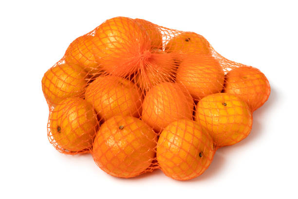 istock Single net with fresh orange mandarins close up on white background 1803759859