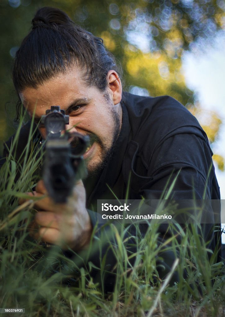 Anger Released Special forces man angry shooting directly on camera and screaming. Activity Stock Photo