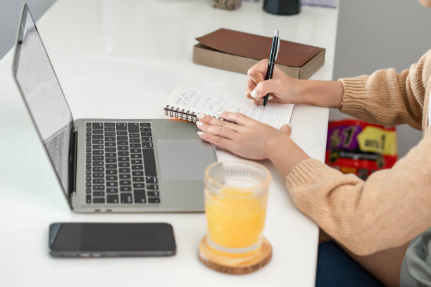 istock Happy young Asian Woman Successful working with laptop checking 1803775969