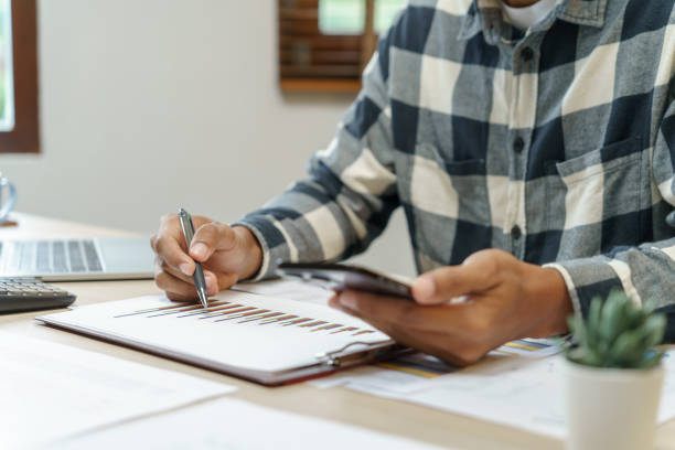 istock Attractive confident Hispanic Business man using laptop computer and professional working investor start up project business planning in office 1803776539