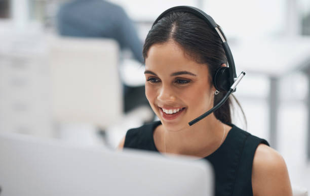 happy woman, face and headphones in call center for customer service, telemarketing or support at office. female person, consultant or agent smile with headset for online advice or help at workplace - atendimento imagens e fotografias de stock