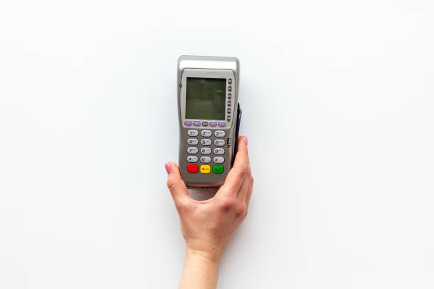 istock Female hand with POS payment terminal. Payment by mobile pay 1803785022