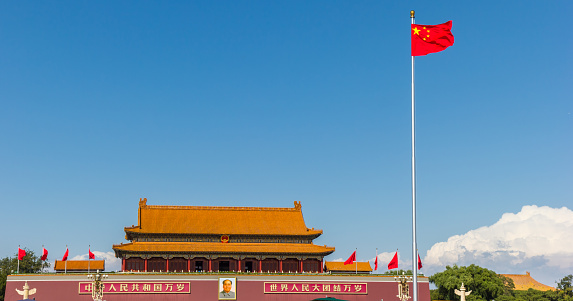 Chinese national flag in front of the Forbidden city in Beijing, China