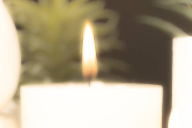 istock Blurred background of burning candle, fire from candle 1803790759