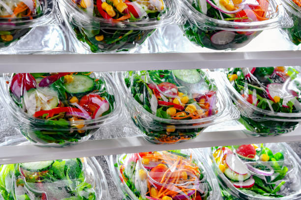 istock Boxes with pre-packaged vegetable salads in a commercial fridge 1803802025