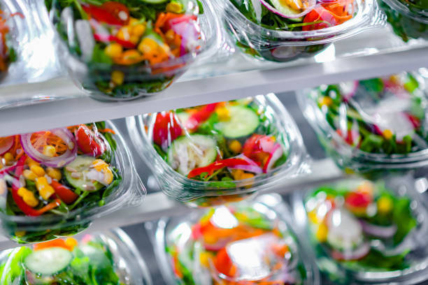 istock Boxes with pre-packaged vegetable salads in a commercial fridge 1803802600