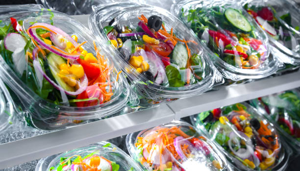 istock Boxes with pre-packaged vegetable salads in a commercial fridge 1803802978
