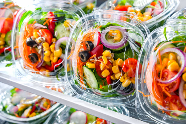 istock Boxes with pre-packaged vegetable salads in a commercial fridge 1803803155