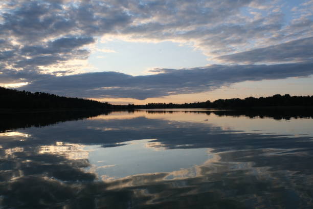 istock Sunset Silhouettes on the Lake 1803816901