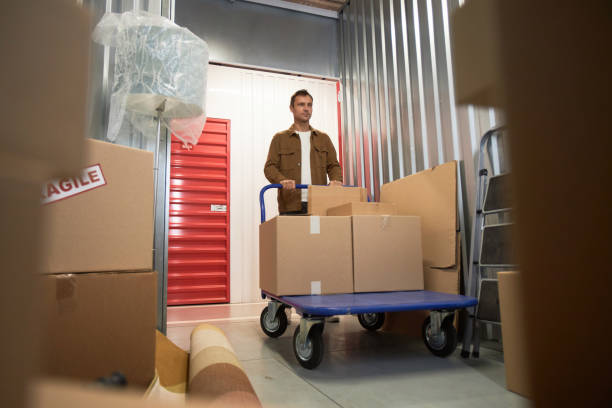 istock Customer Pushing Cart with Belongings 1803816927