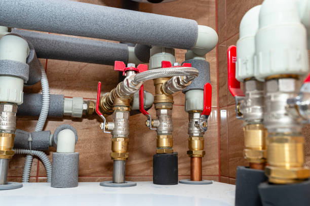 istock Open three-quarter inch valves attached to the heat pump installation, plastic elbows visible. 1803818026