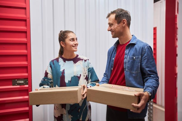 Cheerful Couple Storing Belongings