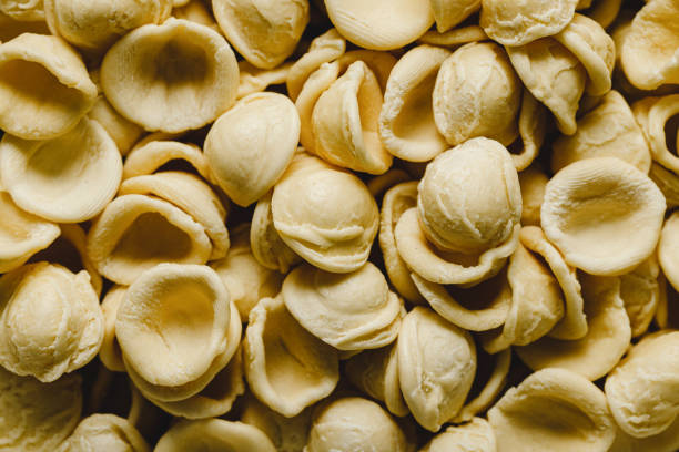 Close-up of uncooked Orecchiette pasta. Full frame of aw Orecchiette pasta,