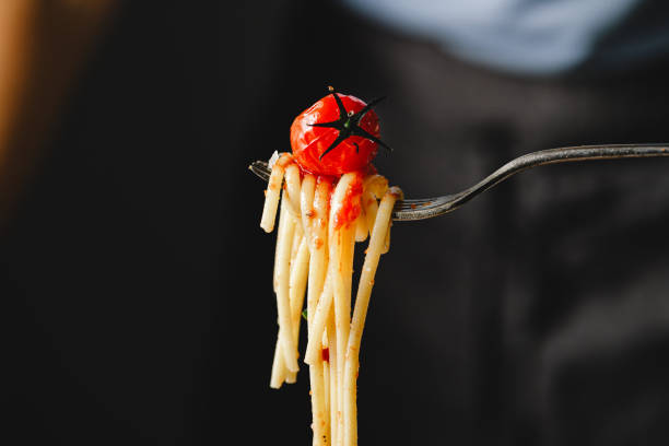 istock Close-up of eating freshly made  pasta with fork. 1803824173