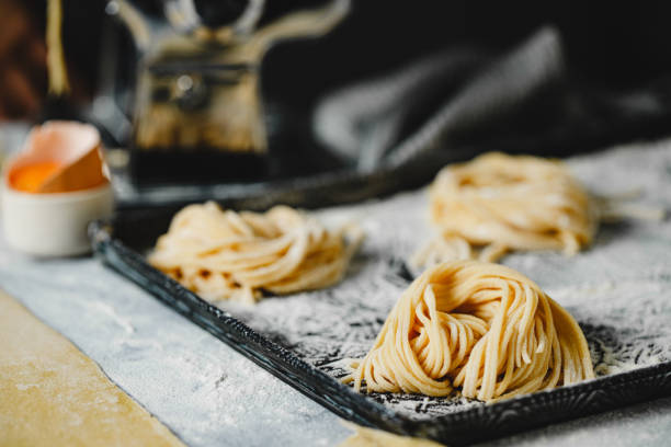 istock Close-up of fresh spaghetti pasta arranged on a tray 1803824175
