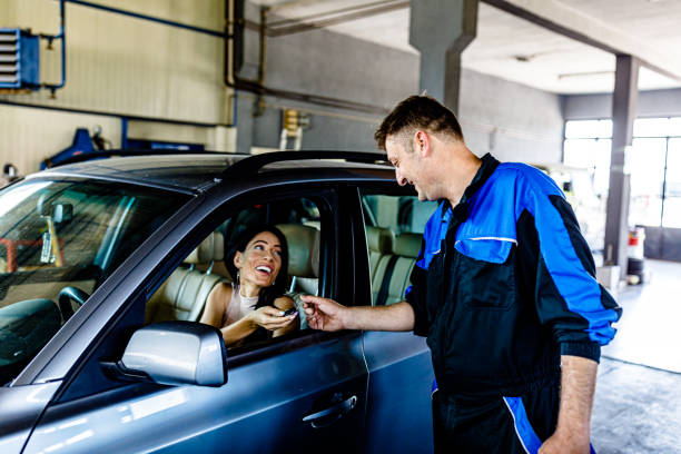 istock A Woman is Taking Car Keys After a Service. 1803828144
