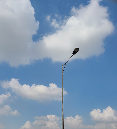 A solitary lamppost stands, like a hero, to illuminate others