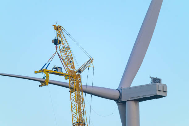 Wind turbine construction with huge cranes at a new wind park in Flevoland, Netherlands.