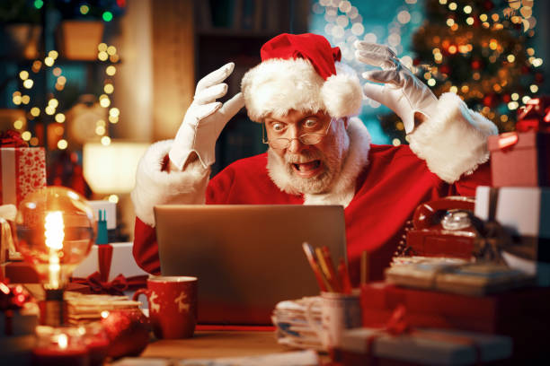 Santa Claus has computer problems stock photo