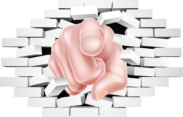 Pointing Hand Breaking White Brick Wall Hand pointing breaking through a white brick wall uncle sam broke stock illustrations